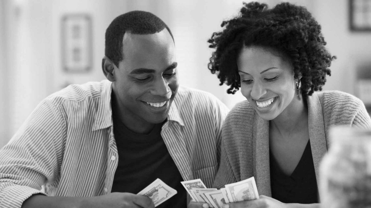 Man and woman counting out money