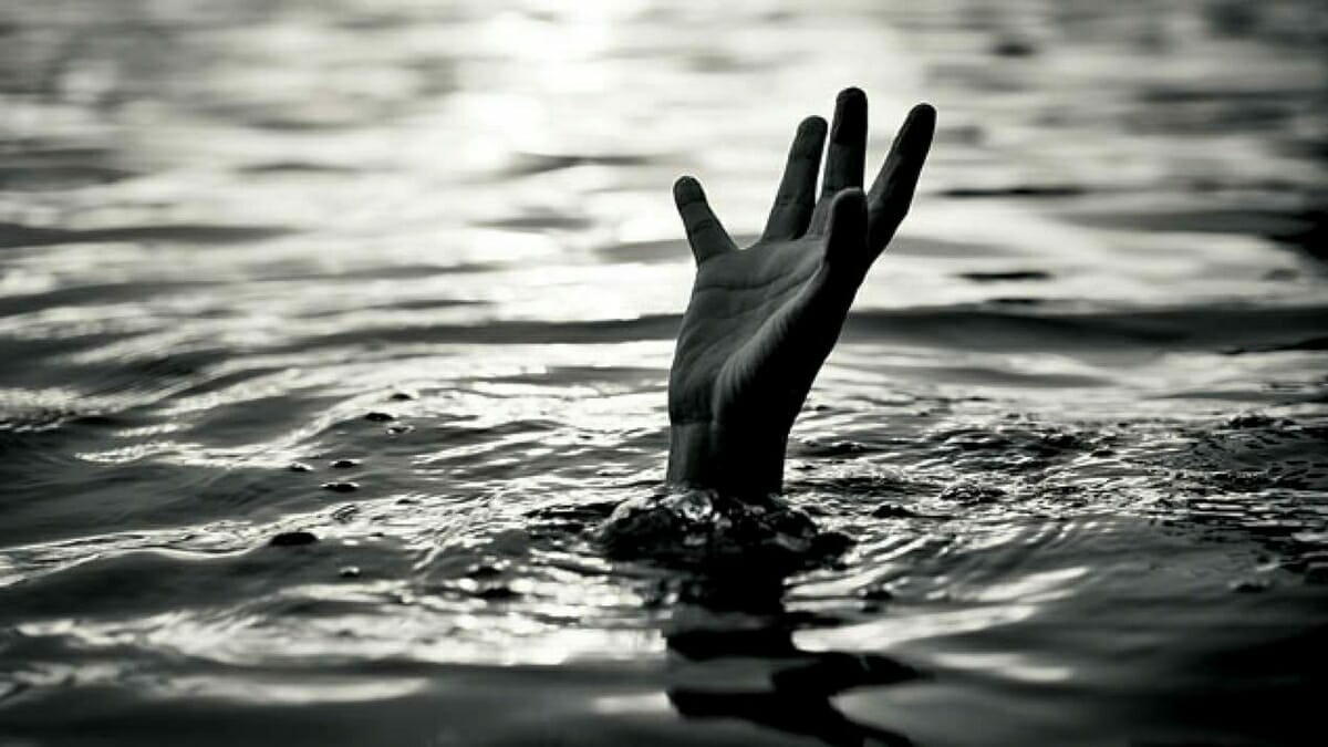 A drowning person reaching out their hand for help.