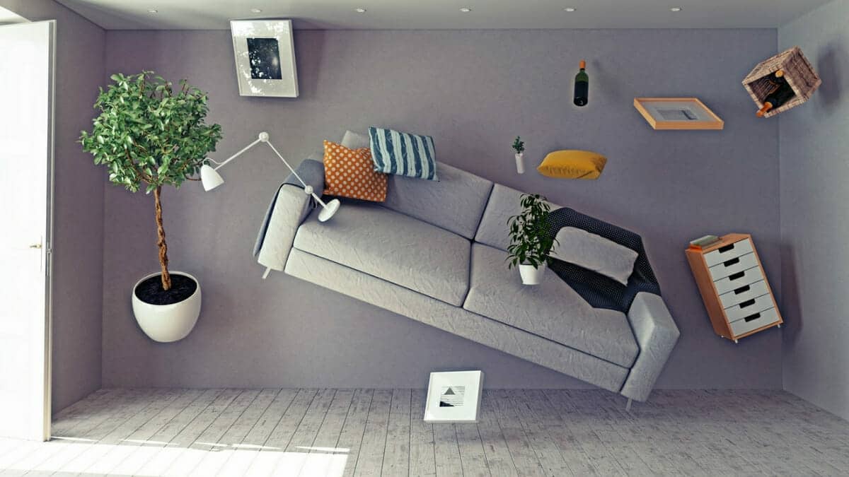 Room with furniture and objects flying in the air