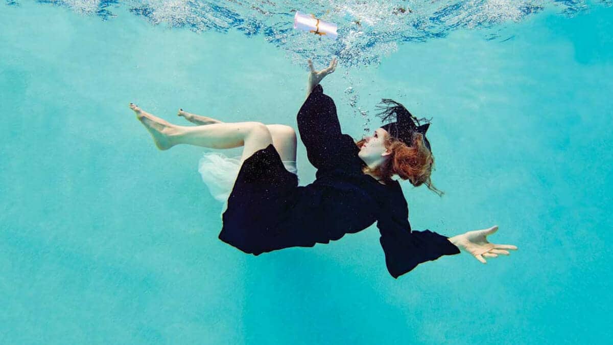 Graduate sinking underwater