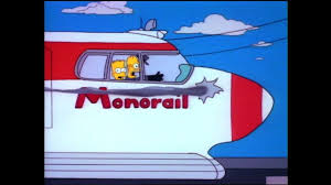 Homer and Bart on the monorail as it goes out of control.