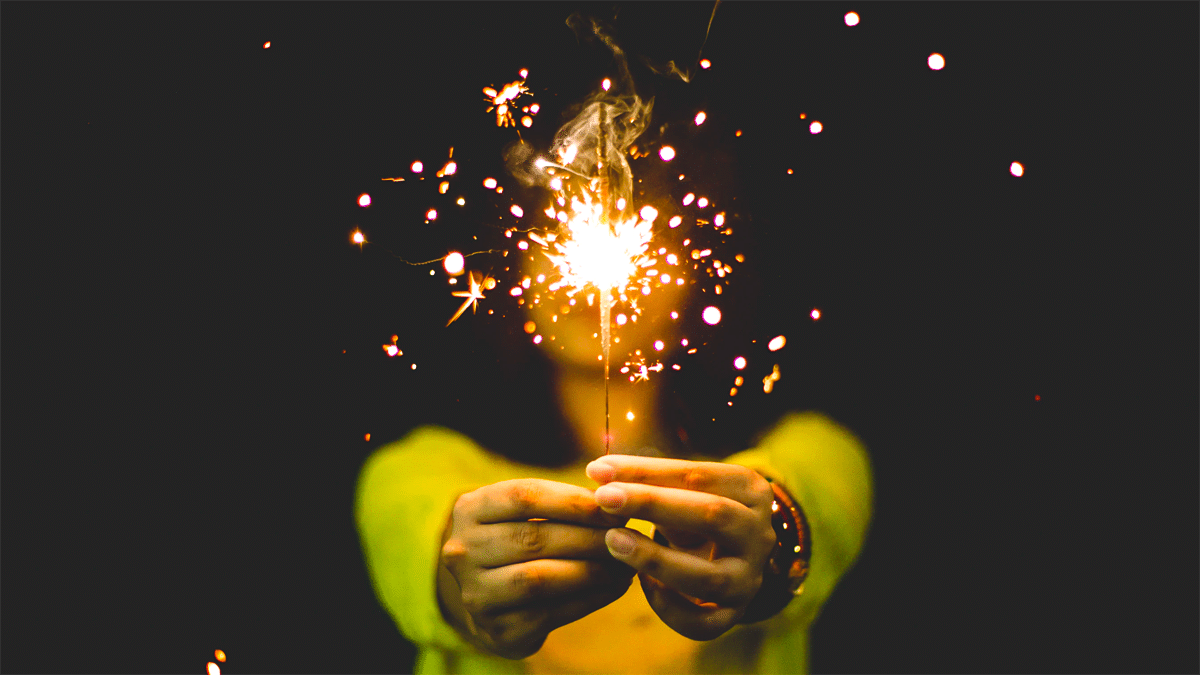 woman holding sparkler