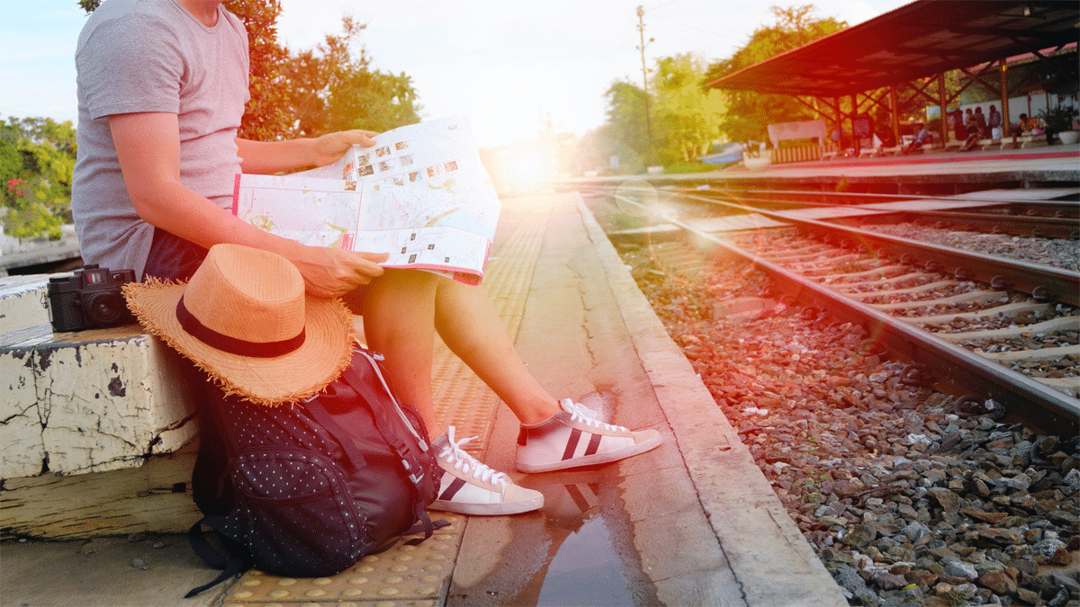 traveler at train tracks