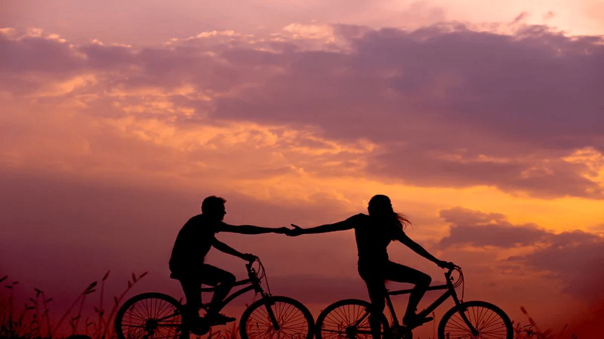 bicyclists at sunset